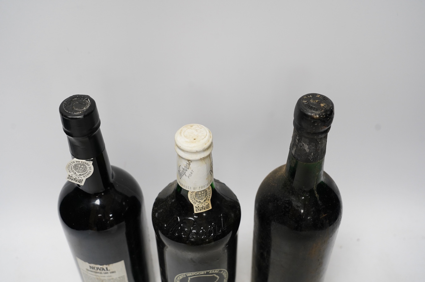 Three bottles of port to include a bottle of Niepoort’s Colheita port vintage 1978, a bottle of Noval 1991 LBV port and a bottle of Cockburns 1970 vintage port. Condition - fair, storage history unknown